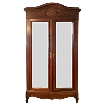 Louis XV style armoire with two bevelled mirror doors.