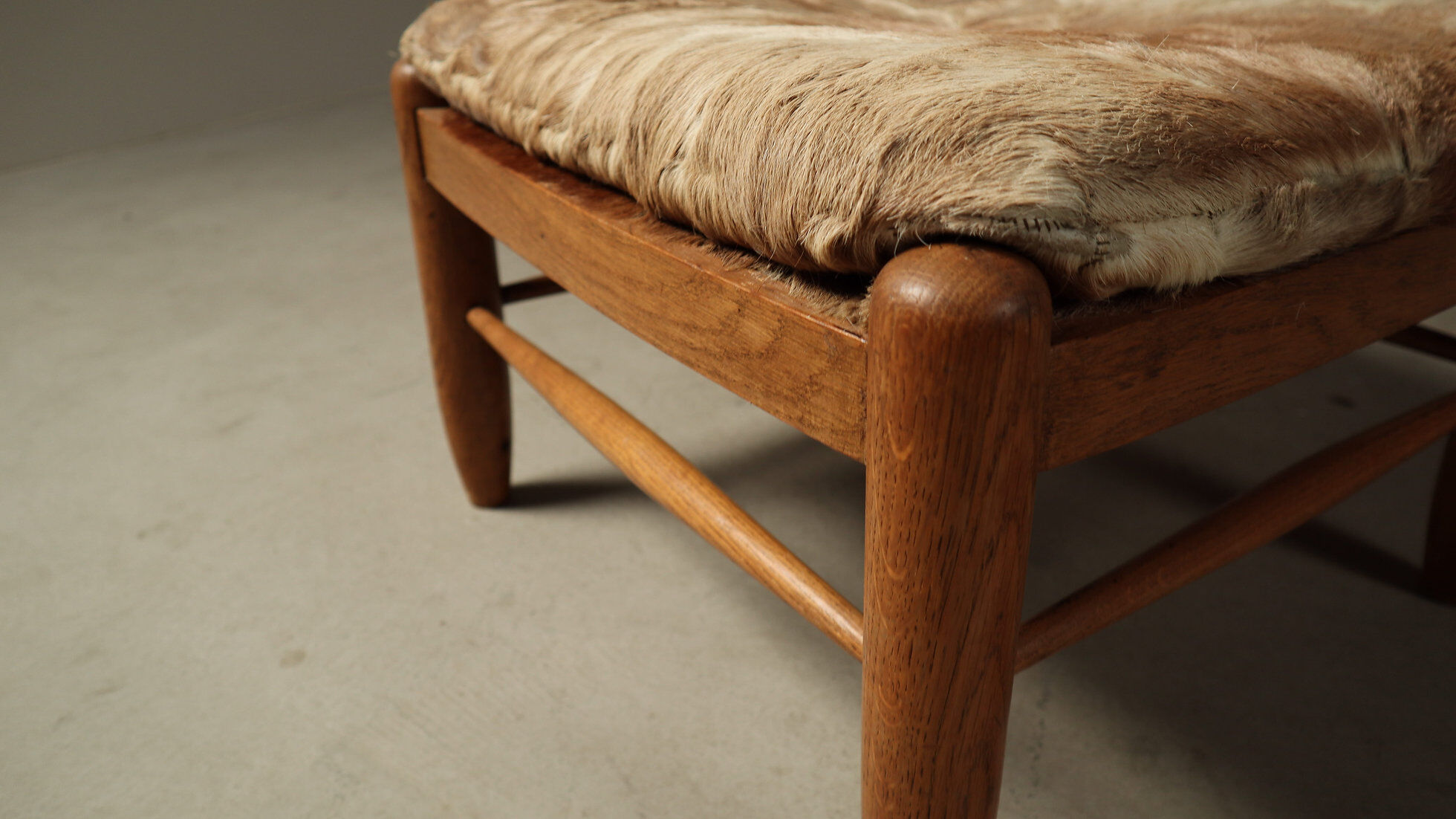 Brutalist oak lounge chair and ottoman in original goat hide, 1960s