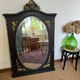 Large old trumeau mirror in black and gilded wood Napoleon style
