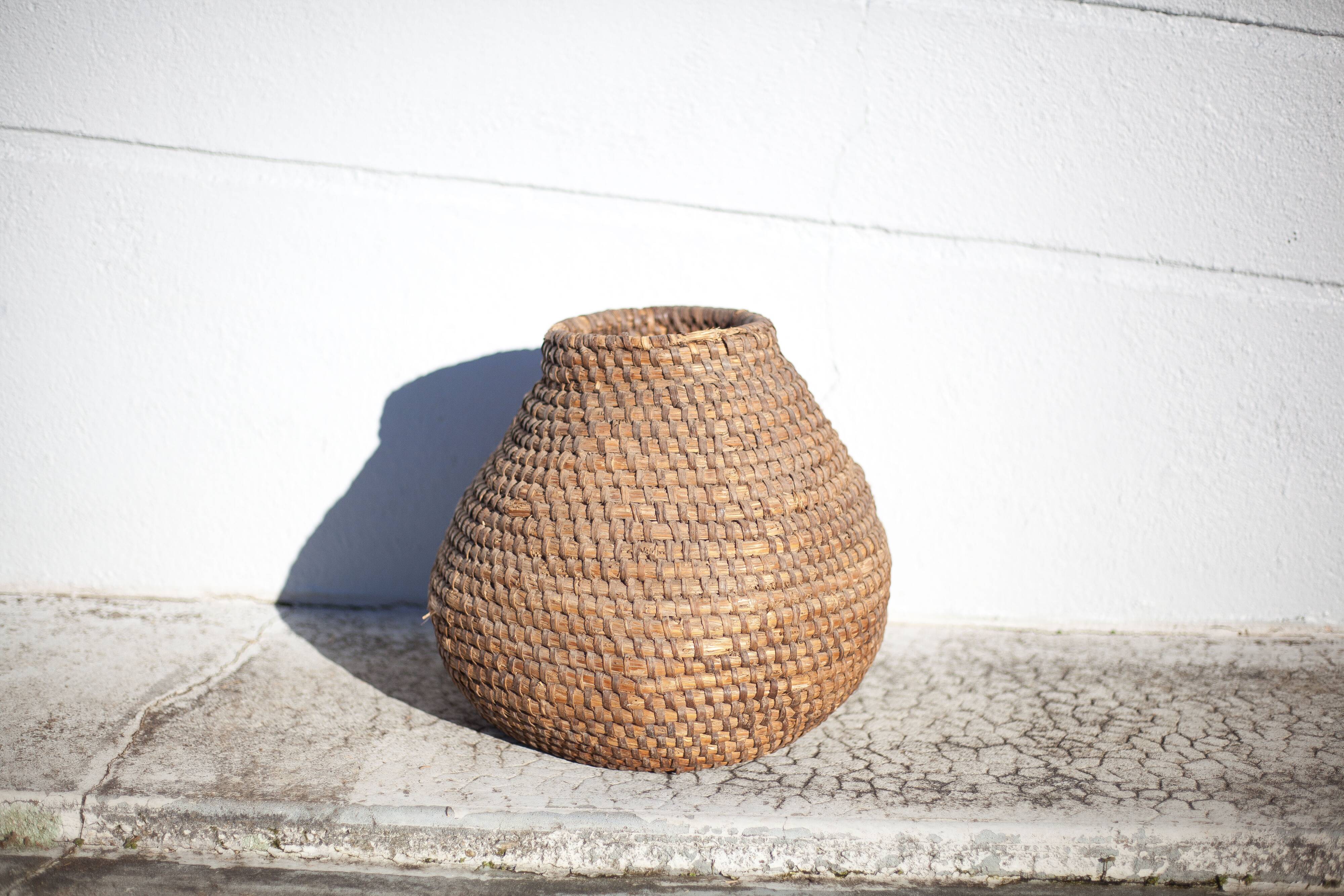 Old basket, burgundy straw and bramble, woven basket, interior decoration