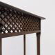 Hexagonal pedestal table or side table with a lattice structure and star pattern.