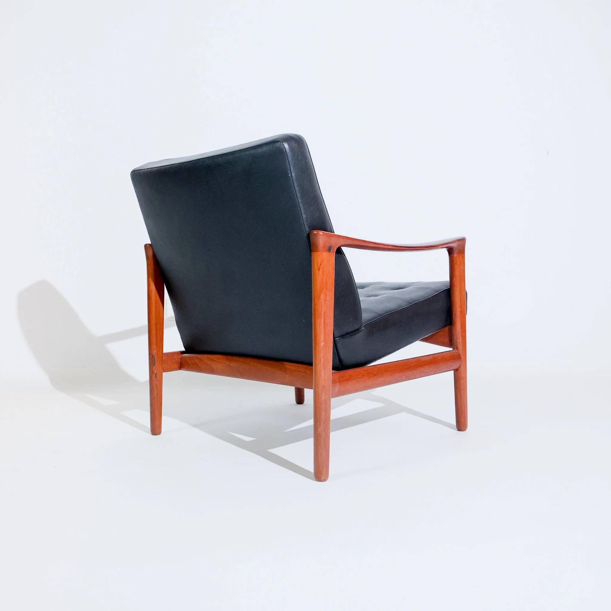 Vintage Scandinavian lounge chair by Bröderna Andersson, teak and black faux leather upholstery, 1950s-1960s.