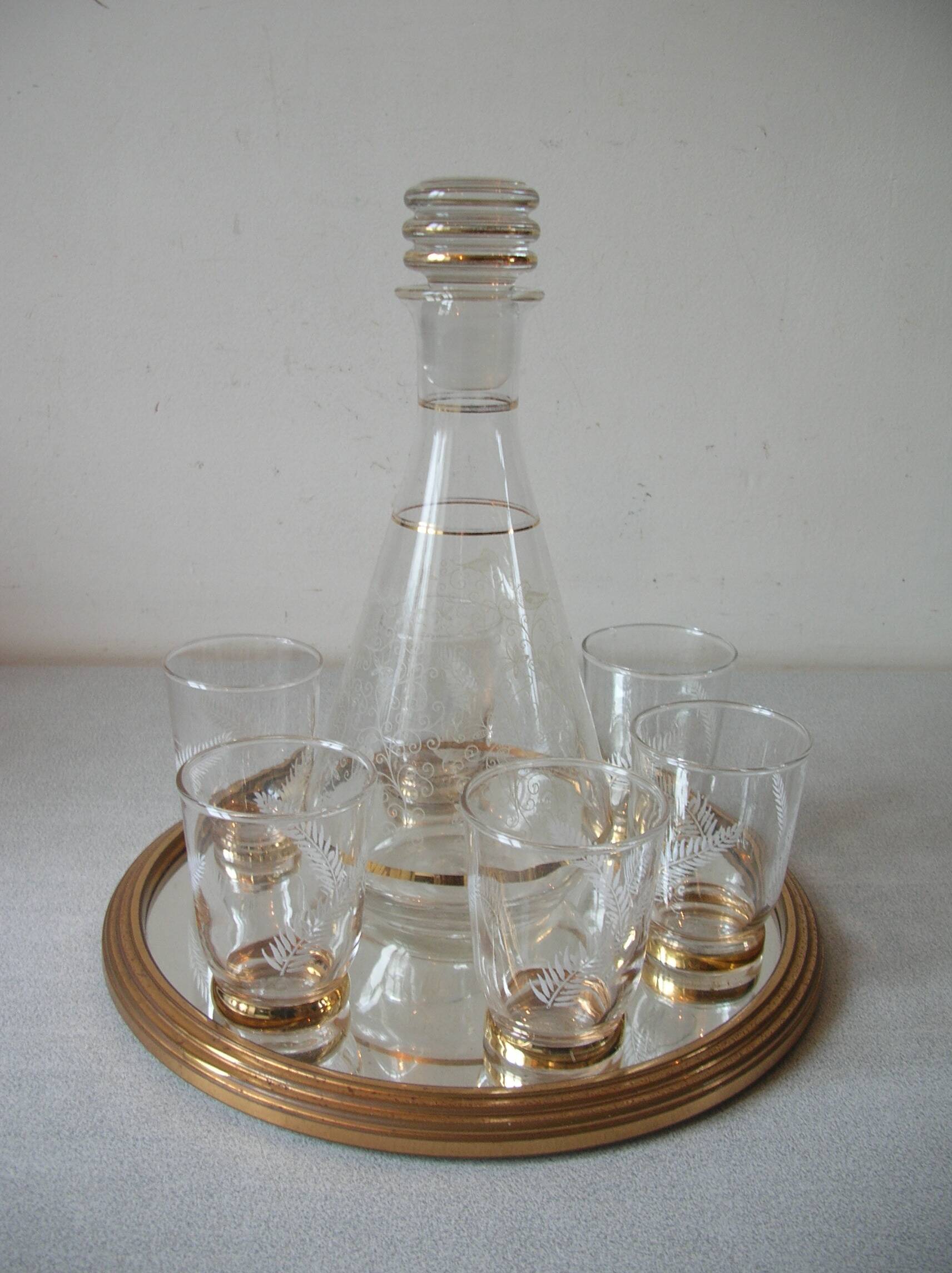 Old glass carafe liquor service with gilding vintage ice mirror tray