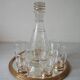 Old glass carafe liquor service with gilding vintage ice mirror tray