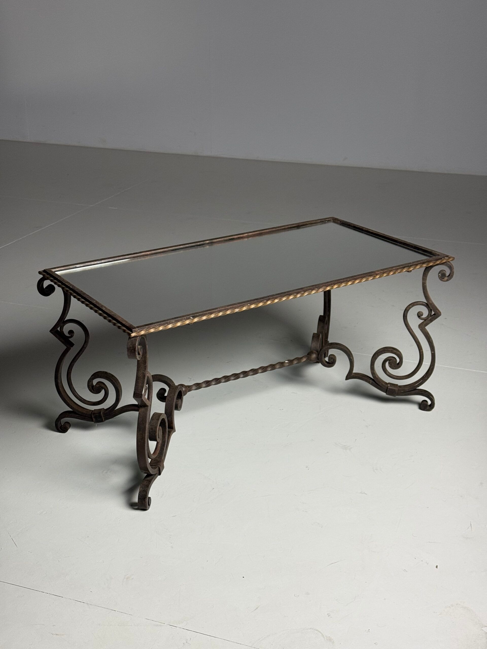 Wrought iron coffee table with mirror glass