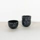 Black and gray ceramic mugs