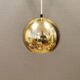 Danish ball lamp from the 80s, in gold colored lacquer.