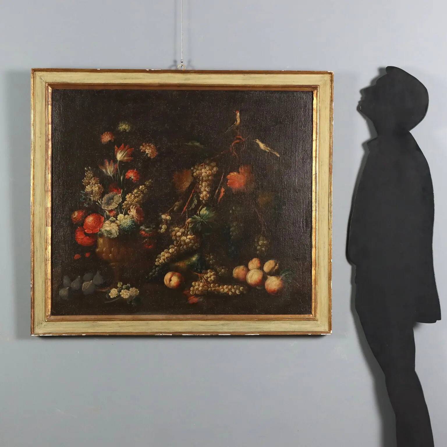 Old painting of still life with flowers, fruits, and birds from the 18th century.