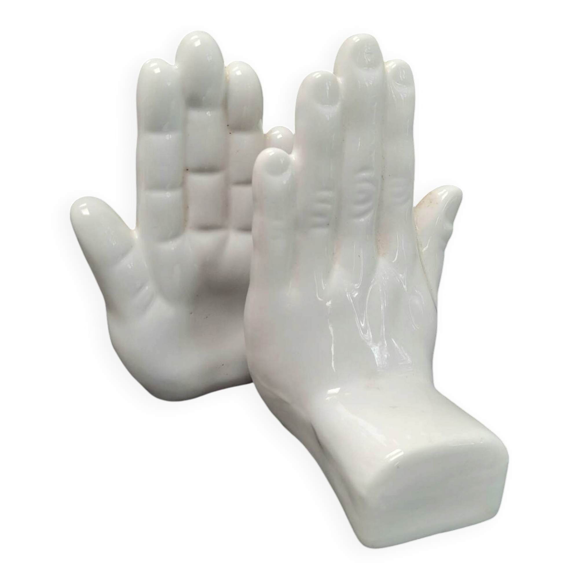Ceramic bookends in the shape of hands.