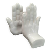 Ceramic bookends in the shape of hands.