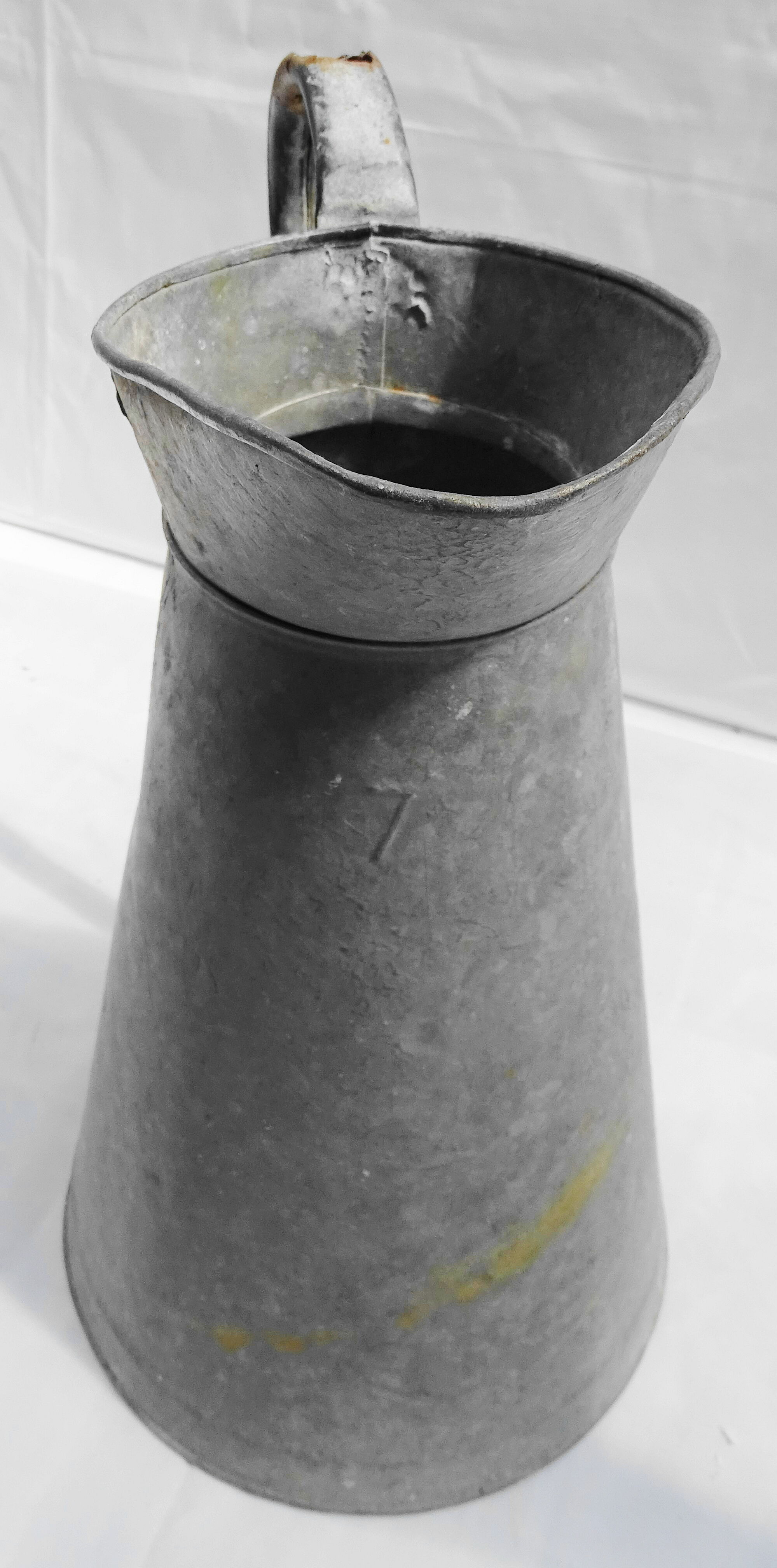 Old zinged metal broc