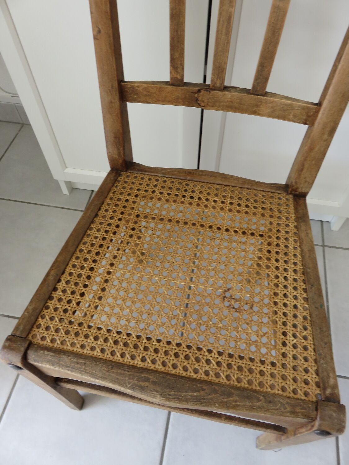 Antique solid wood chair with caning, country house style.