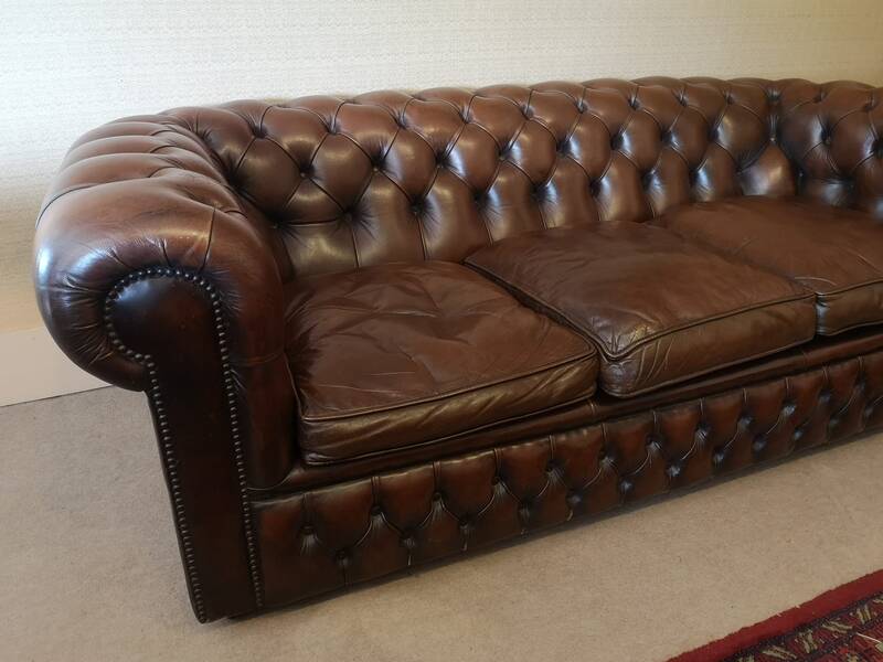Vintage three-seater brown leather Chesterfield sofa