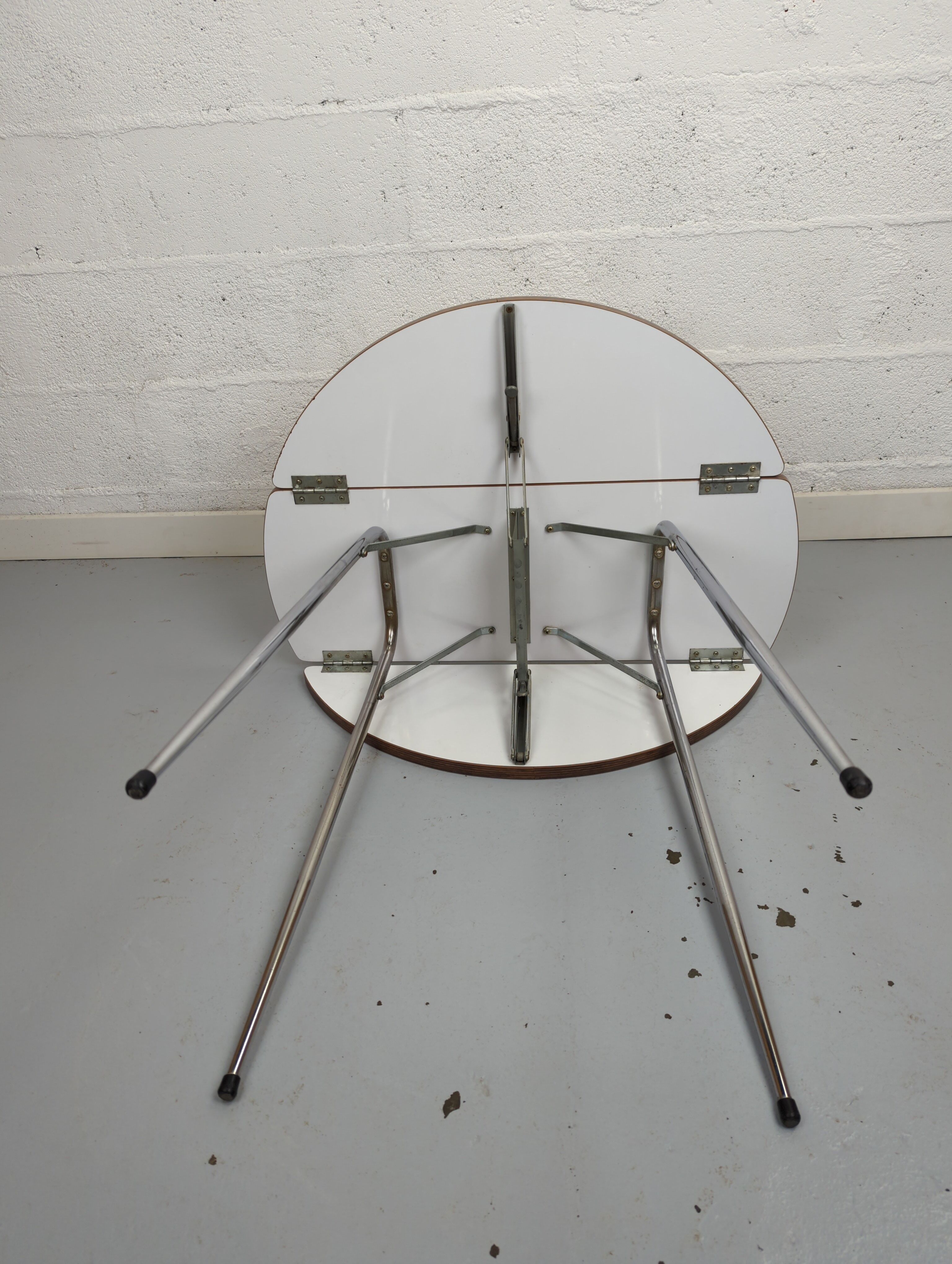 Foldable brown formica table compass legs