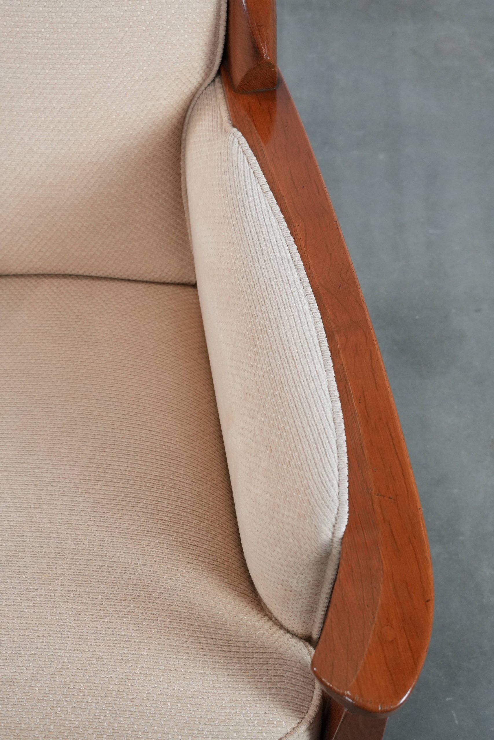 Art Nouveau design armchair with a luxurious light fabric upholstery