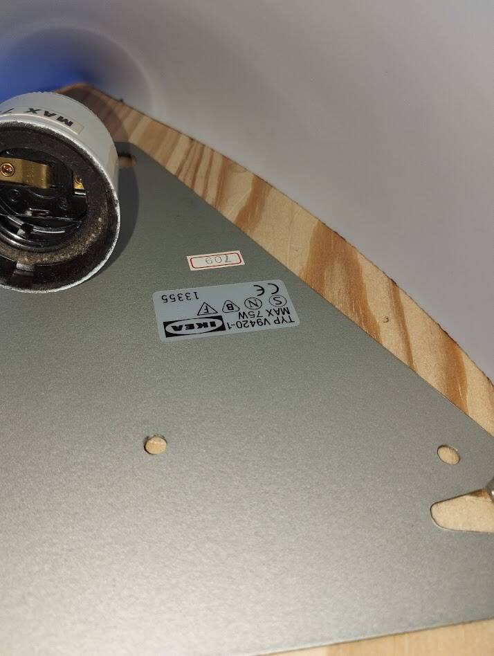 a pair of Ikea Kvintett wall lamps