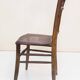 Chair with a slatted backrest and caned seat.