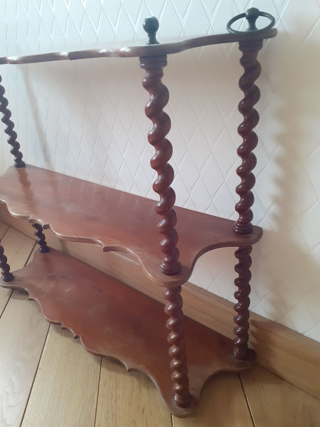 Turned wooden wall shelf