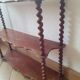 Turned wooden wall shelf