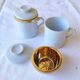2 white and gold Limoges porcelain tea cups