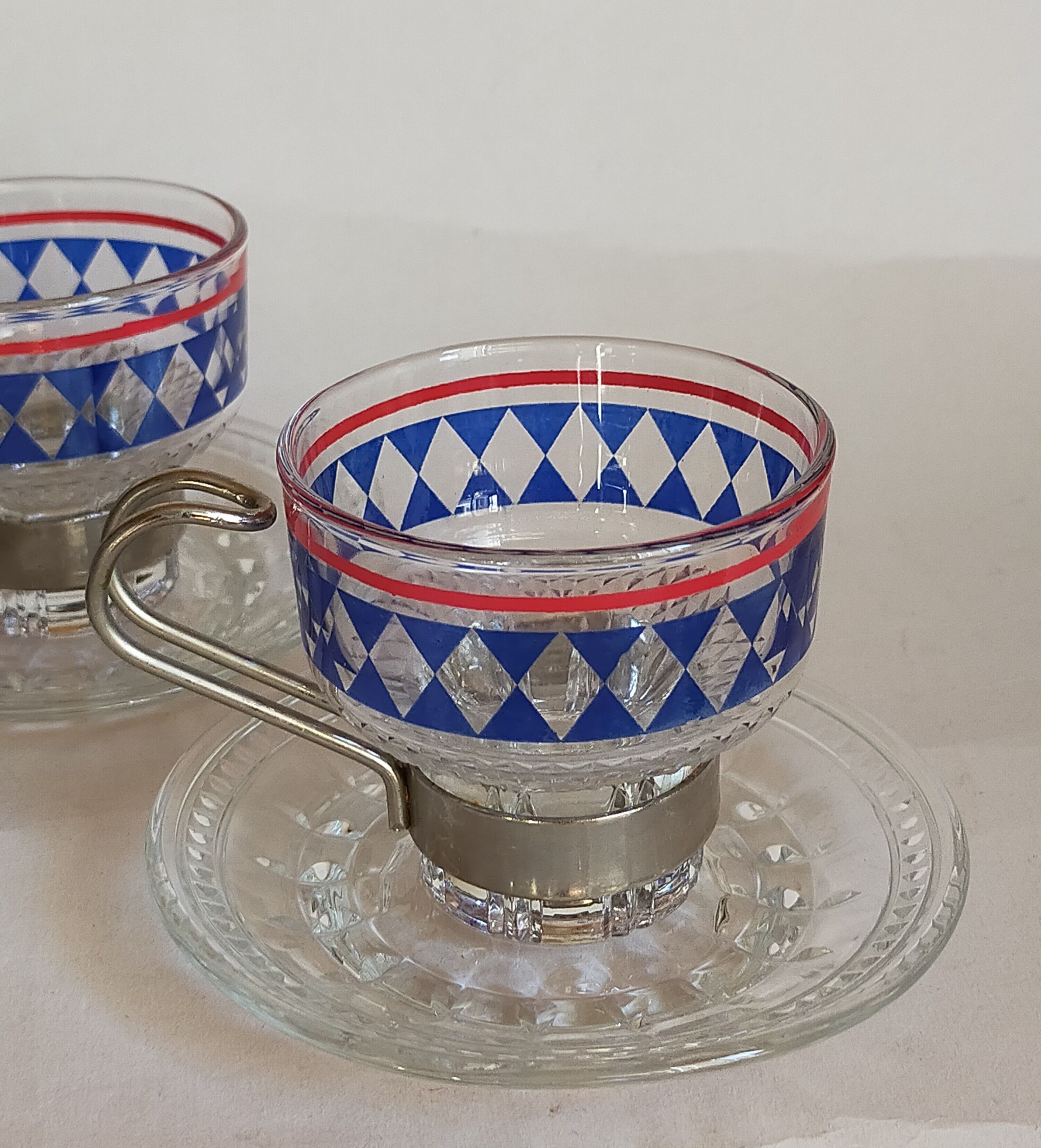Four vintage coffee cups screen printed glass and metal