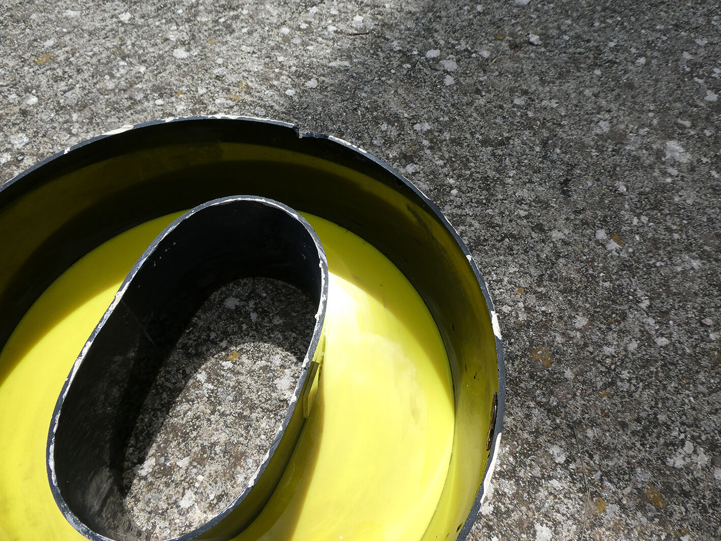 Letter "O" of industrial sign yellow and black