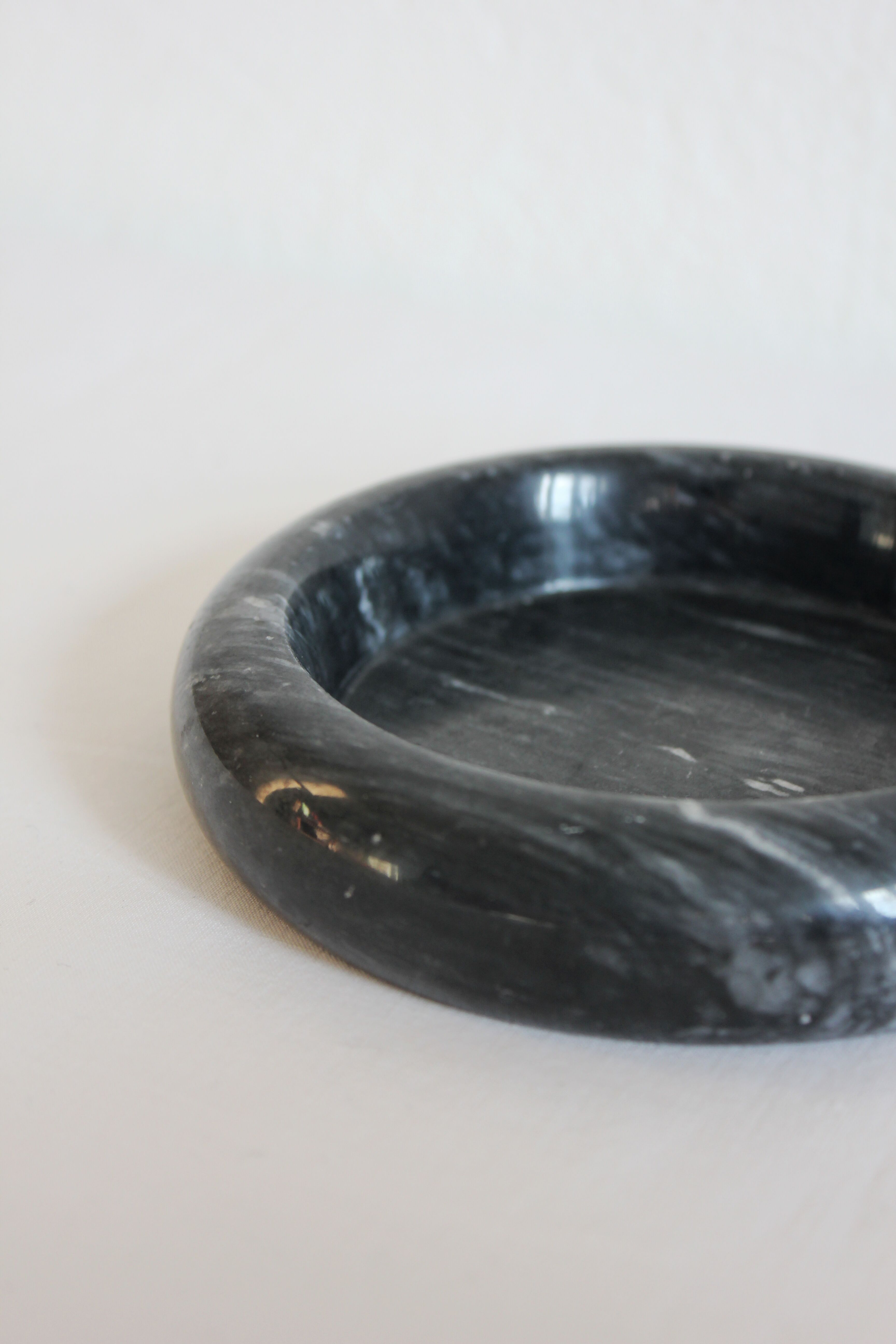 Ashtray or empty black marble pocket