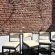 Many mid-century vintage wooden and fabric chairs.
