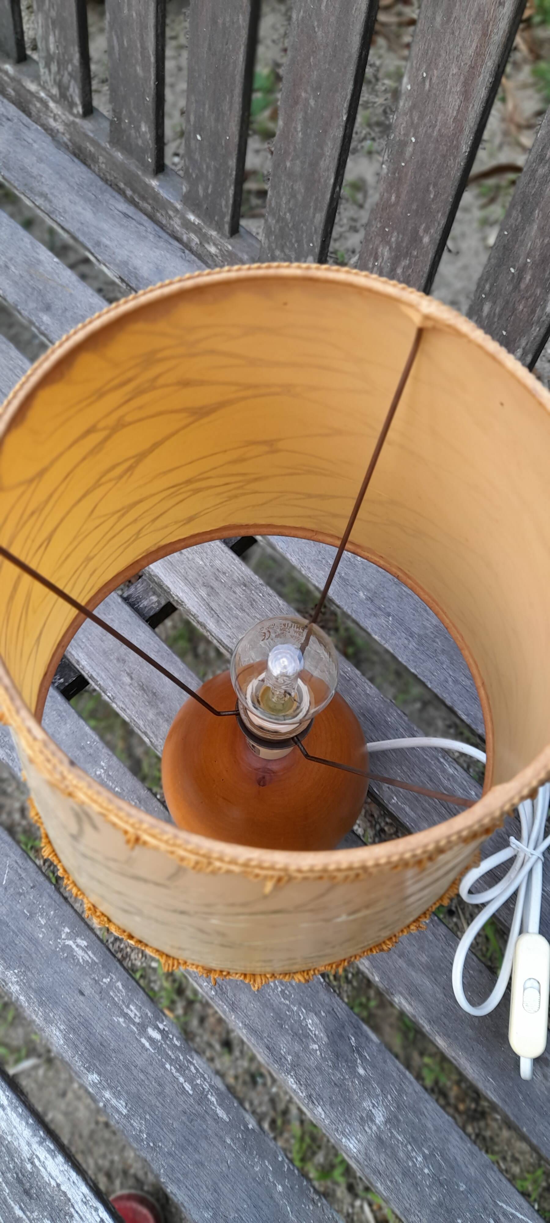 Light wood round foot laying lamp and old lampshade