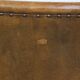 Cognac-colored sheepskin and wooden Art Deco design armchair