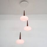 Set of three milk glass and teak pendant lights model NG74 by Louis Kalff for Philips, The Netherlan