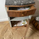Pair of mismatched art deco bedside tables in green and wood