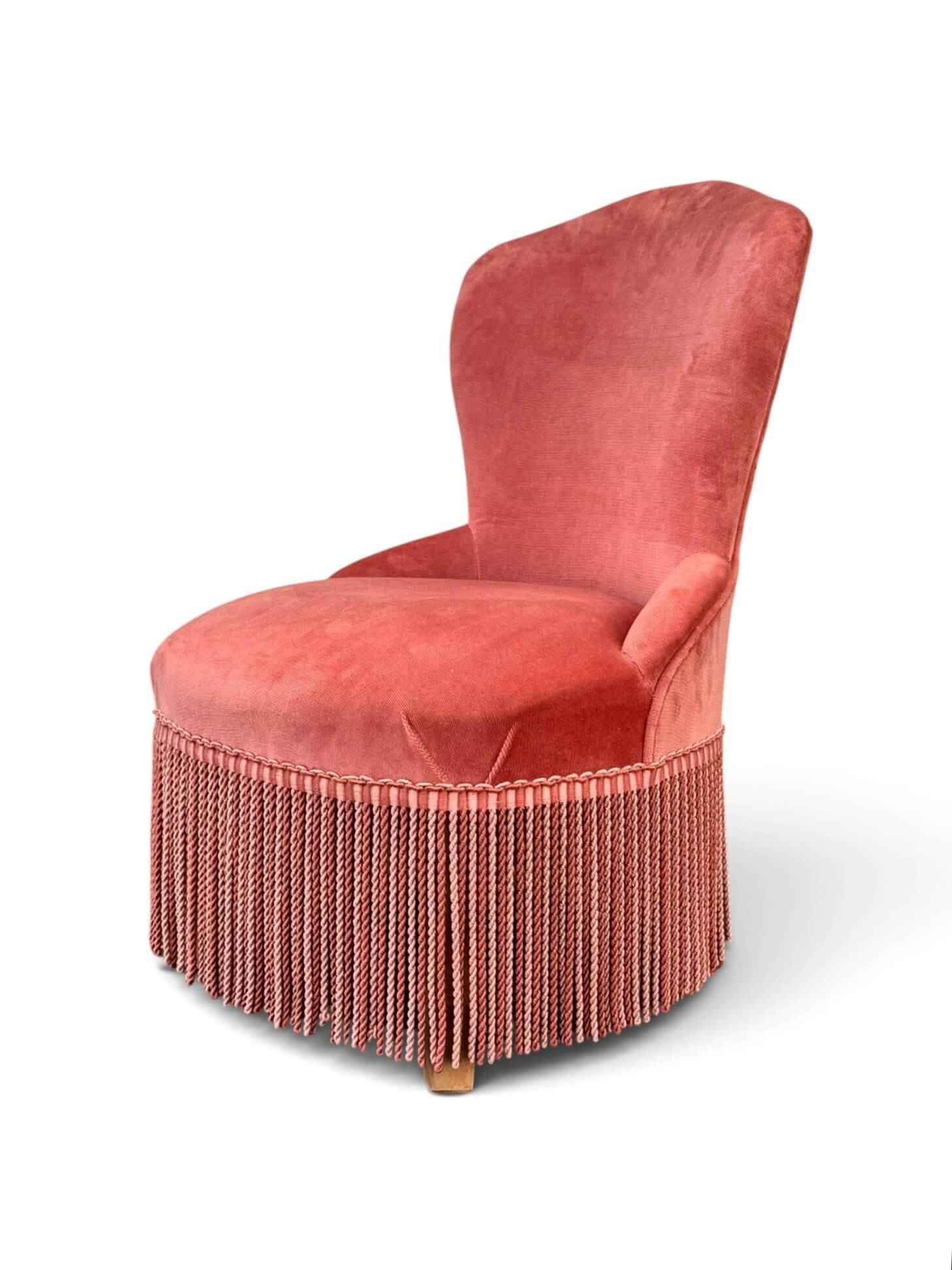 Vintage pink velvet fringed armchair