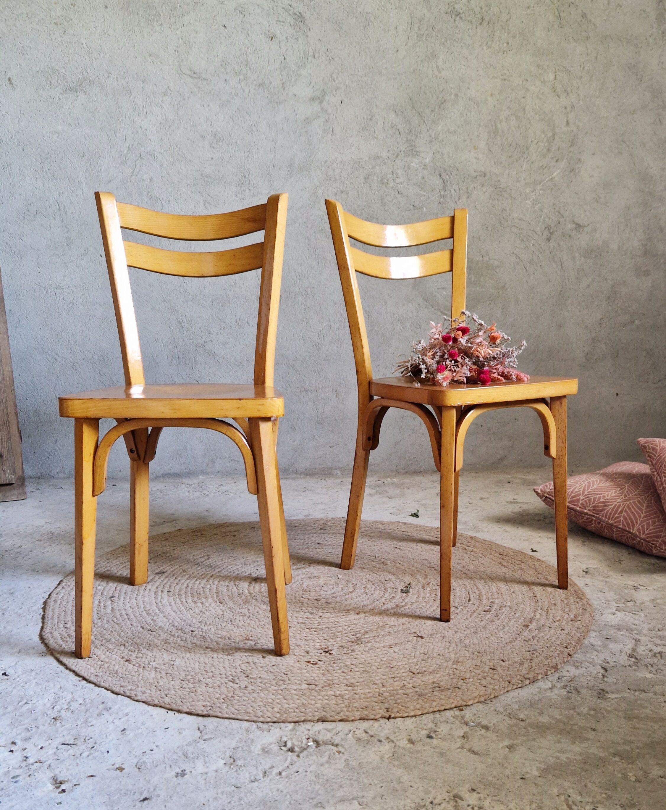 Old and pretty pair of Baumann bistro chairs