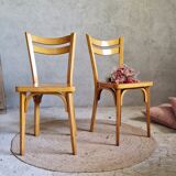 Old and pretty pair of Baumann bistro chairs