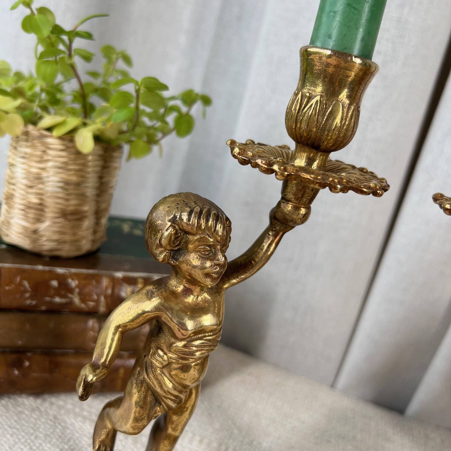 Pair of bronze “Cherubim” candlesticks