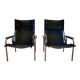 Pair of reclining black leather armchairs, "Hans Eichenberger" design, 19
