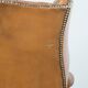 Fauteuil Chesterfield anglais classique en cuir de vachette couleur cognac clair