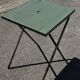 Folding garden or bistro table in khaki sheet metal from the early 1950s.