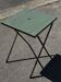 Folding garden or bistro table in khaki sheet metal from the early 1950s.