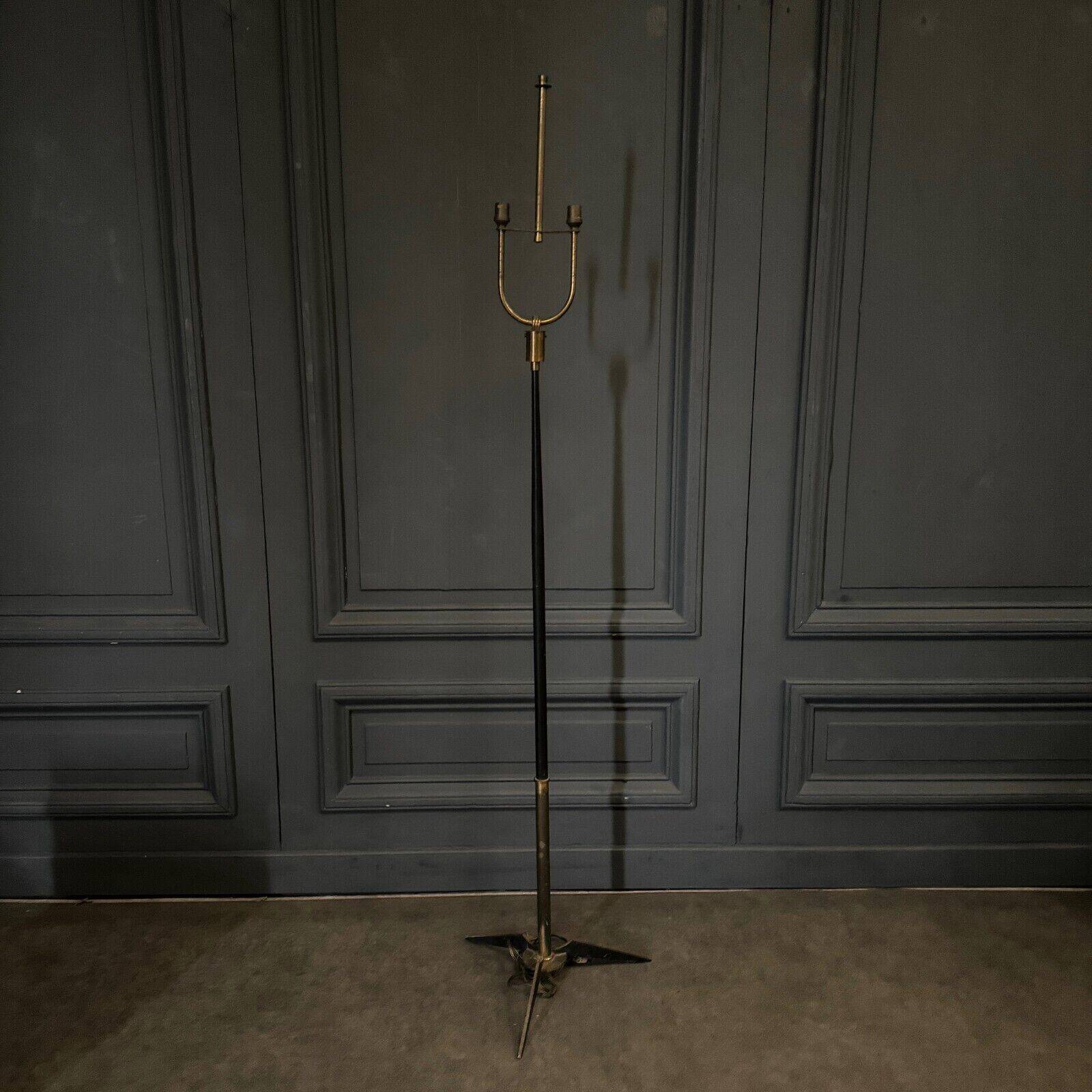 1960 floor lamp on gold metal winged base with black barrel