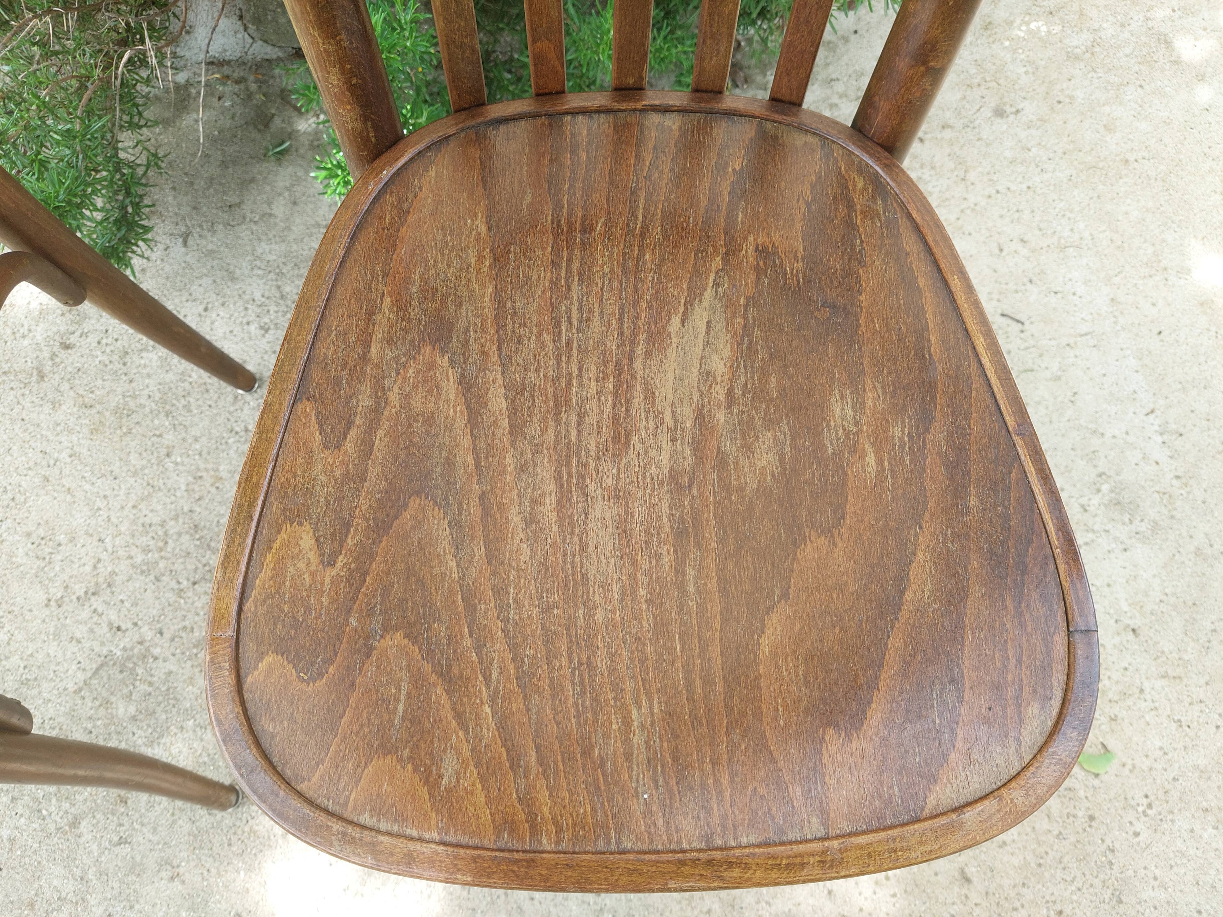 pair of dark bistro chairs, rounded backs, Baumann style