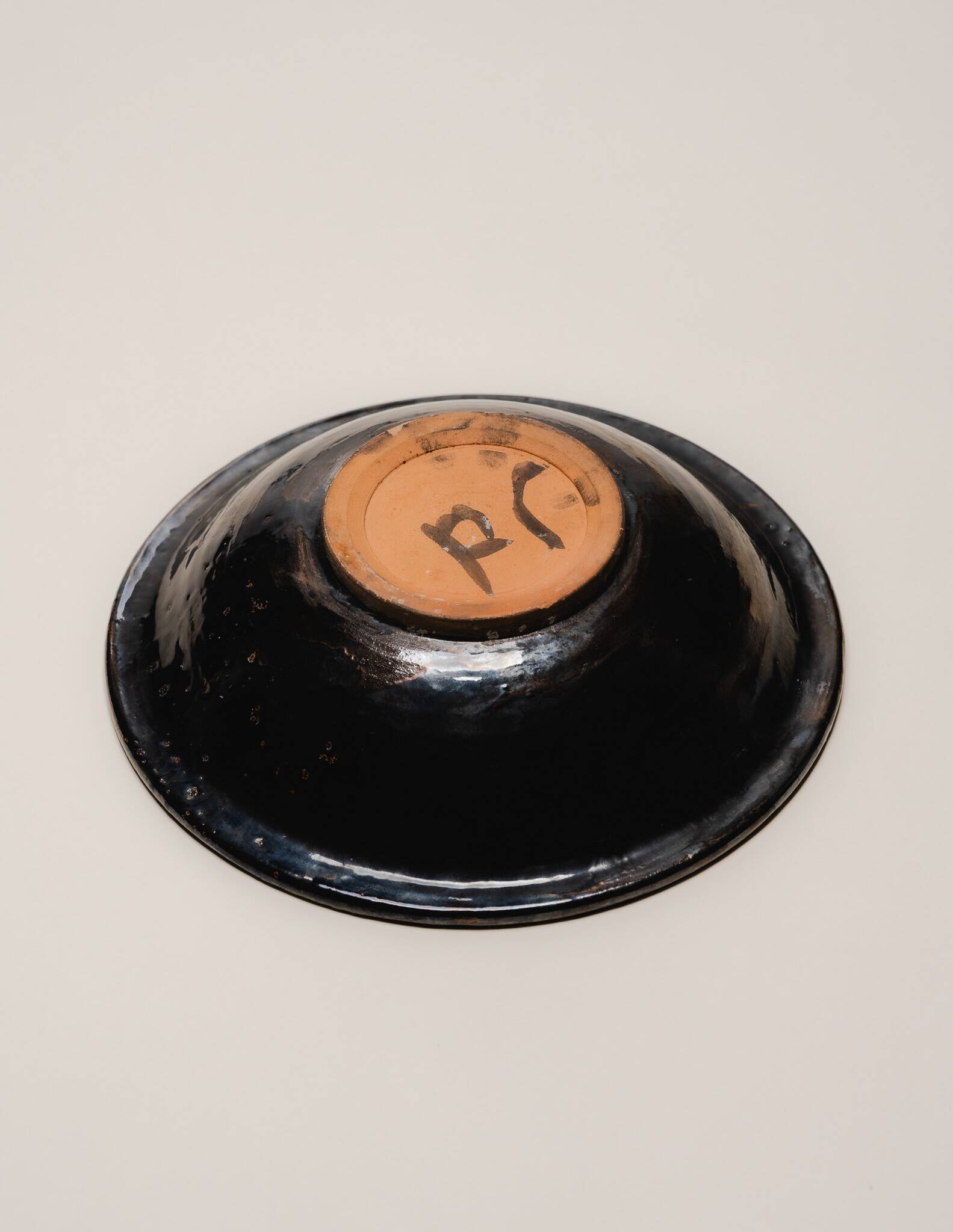 Assiette en céramique émaillée oeil, 1950