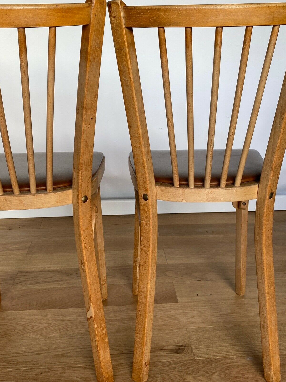 Four chairs Baumann 1960 with bars seated skaï brown label