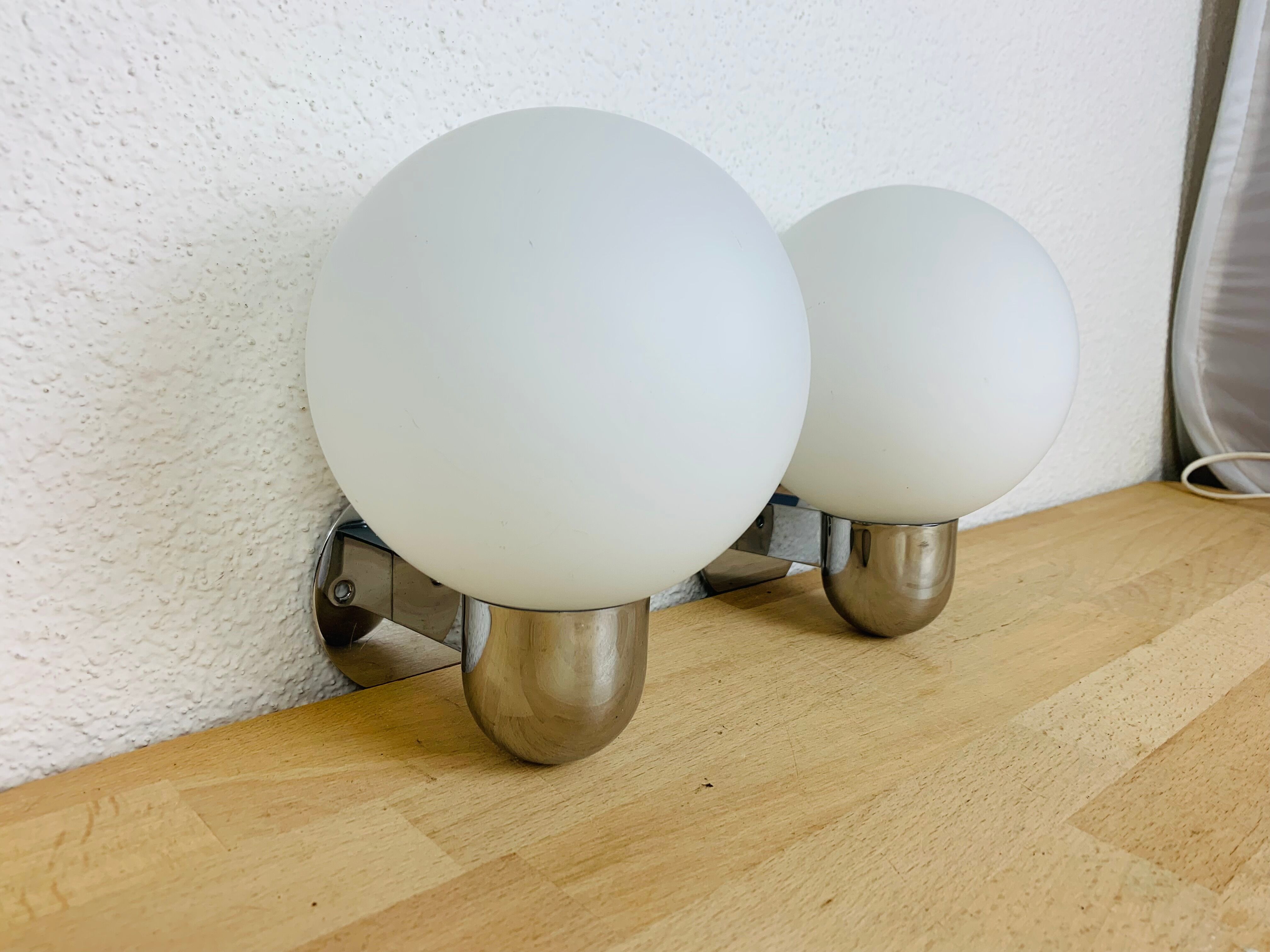 Pair of wall lamps space age chrome and opal globe 70s