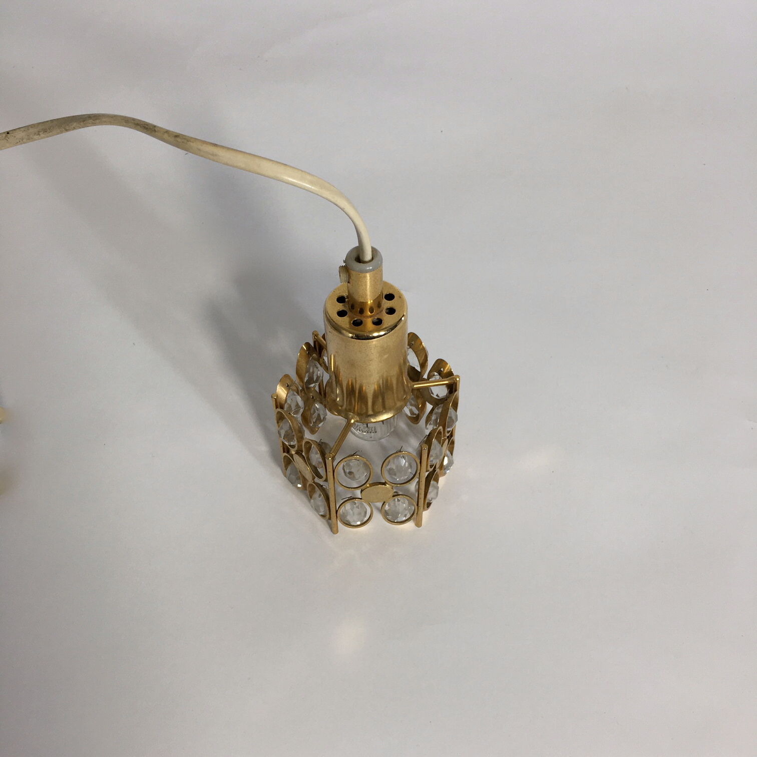 Two pendant lights in gilded brass and crystal, by Palwa, design 1960