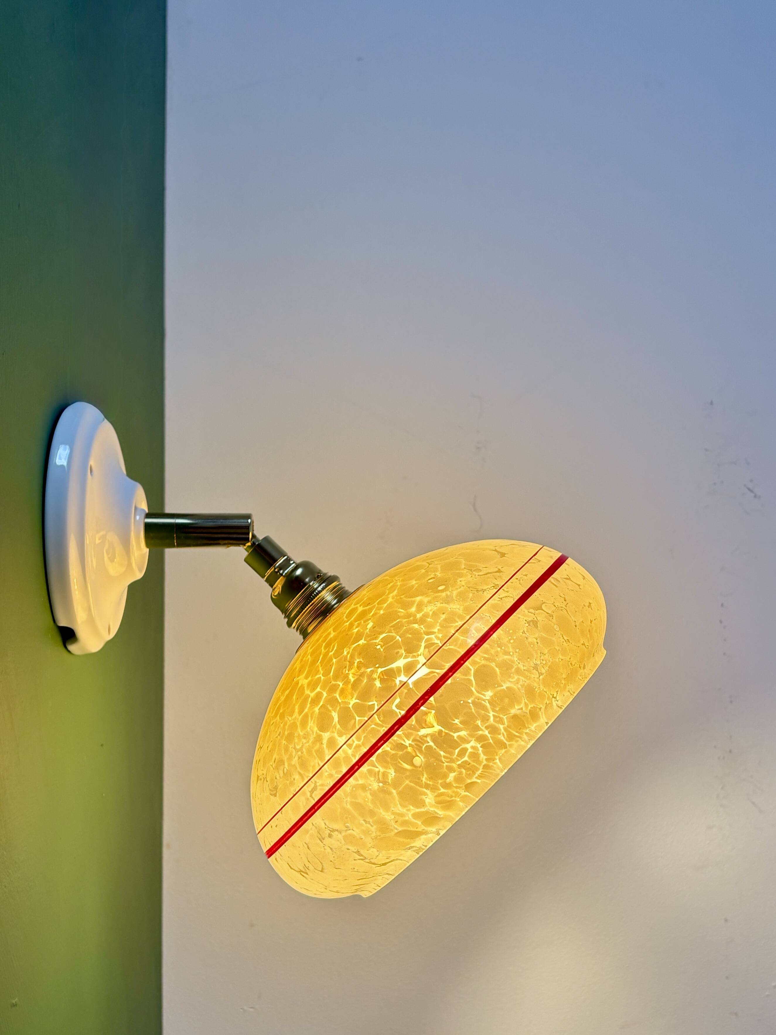 Vintage wall lamp with yellow clichy glass shade and red trim