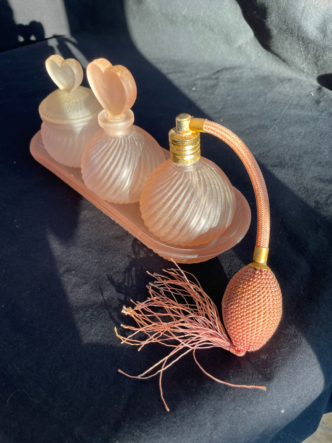 Set of vintage glass pink perfume bathroom jars