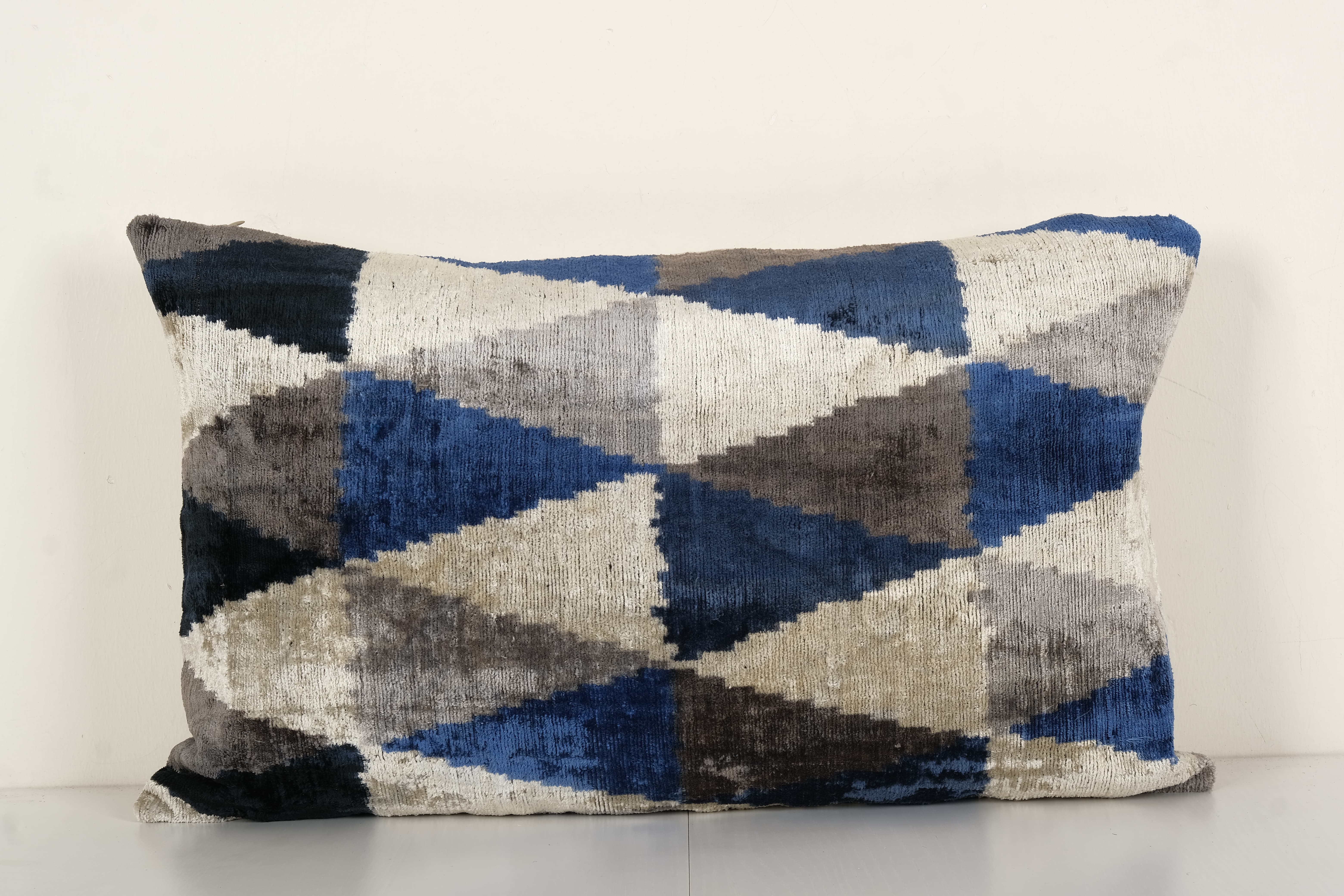 Geometric ikat velvet lumbar pillow