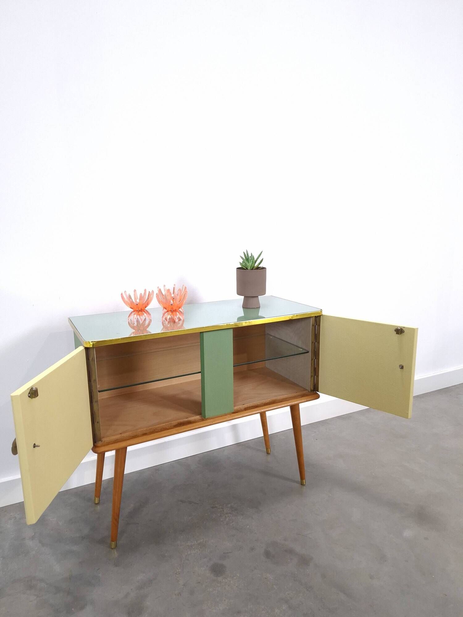 Vintage green DDR cabinet, model Libelle with glass top, slanted legs.